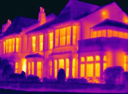 Thermal image of houses on city street.
