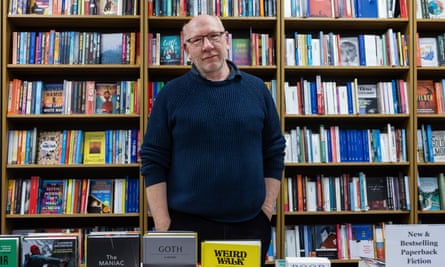 Ross Bradshaw in front of bookshelves