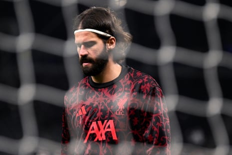 Liverpool goalkeeper Alisson warms up before his side’s match at the Tottenham Hotspur Stadium.