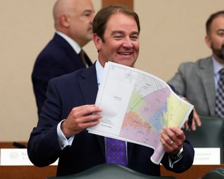 Texas state representative John McQueeney looks through US congressional district maps during a redistricting hearing at the Texas capitol on 24 July 2025.