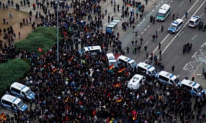 Aerial view of crowds and police vans