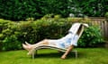 Man relaxing in the garden on a sun lounger
