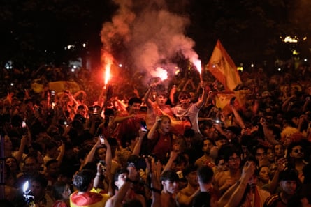 Spanish fans celebrate in central Madrid after Ferran Torres scores his team's first goal.