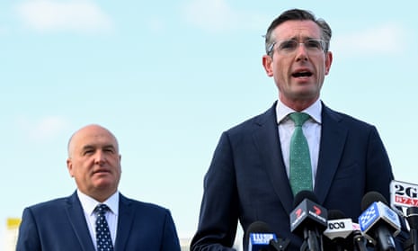 Dominic Perrottet flanked by David Elliott at a press conference in November