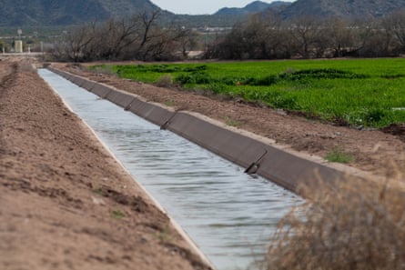A canal on the Gila River Indian Community. Pinal County has six irrigation districts that distribute water to farmland via a network of canals and ditches.