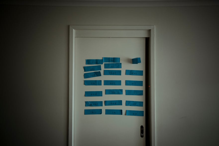 English word card prompts on a door in the Ramazan household