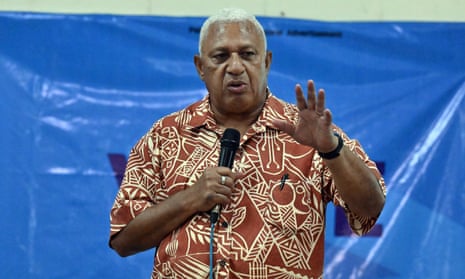 Former Fiji prime minister Frank Bainimarama speaks to supporters at a community hall meeting during the Fijian election campaign.
