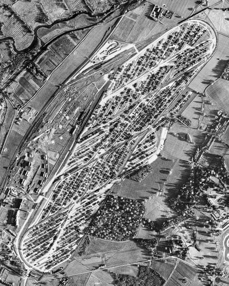 An aerial view of Newbury racecourse covered in rows of military equipment