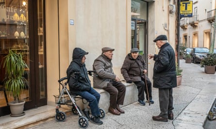 Local people gather on the street in Castelvetrano
