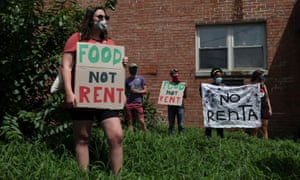 People gather outside an apartment complex with the intention to stop the alleged eviction of one of the tenants in Mount Rainier, Maryland, on Monday.