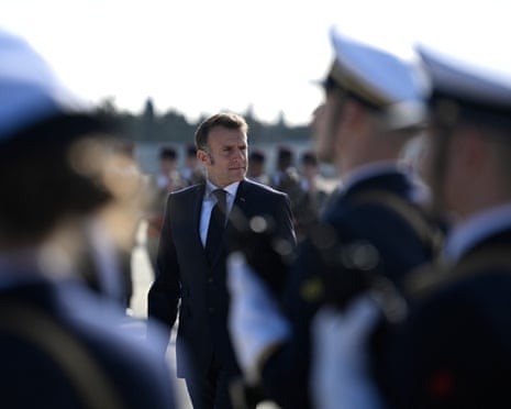 French president Emmanuel Macron (C) reviews troops upon his arrival at the Istres military air force base.