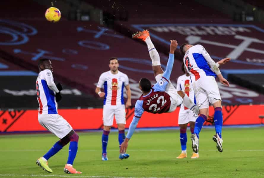 West Ham United’s French striker Sebastien Haller scores an acrobatic goal against Crystal Palace at The London Stadium.