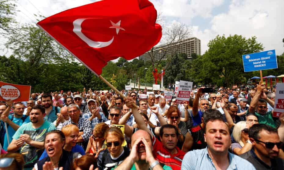 Red flag … Turkish people at a protest in Istanbul.
