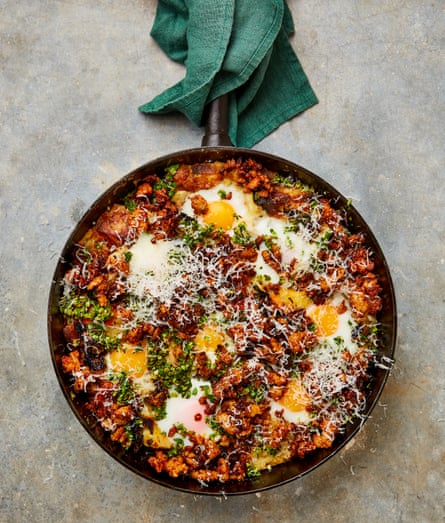 Yotam Ottolenghi’s roasted vegetable and egg bake with paprika sausages.