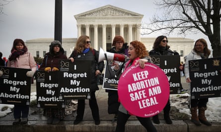 Pro-choice and anti-abortion protesters gather in front of the US supreme court building during the Right to Life march on 18 January, in Washington DC.