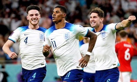 England’s Marcus Rashford celebrates scoring his side’s opener against Wales