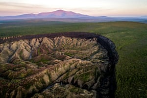 The Batagaika crater has over 200,000 thousand years of history and climate information within the permafrost of this thermokarst depression, and just as many years of methane that could be released into the atmosphere.