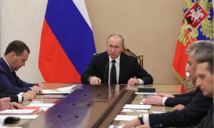 Russia’s President Vladimir Putin (centre) and Russia’s Prime Minister Dmitry Medvedev (left) during a meeting of the Russian security council in the Kremlin.