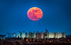 The second full moon rises in the sky over Hull, UK