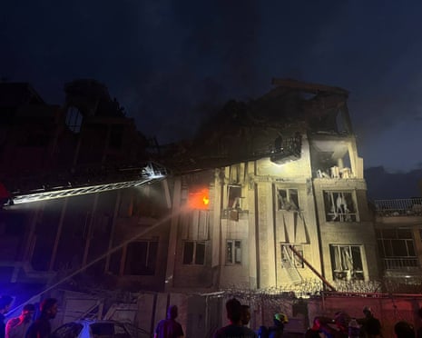 This handout photo released by Iran's Revolutionary Guard Corps (IRGC) official Sepah News Telegram channel reportedly shows a building in Tehran hit in an Israeli strike.