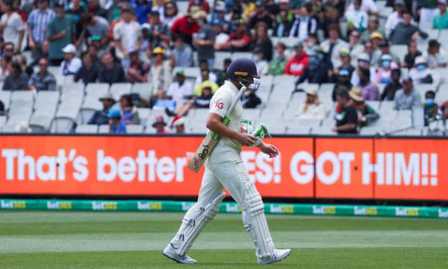 A dejected Jos Buttler leaves the field after being dismissed by Nathan Lyon