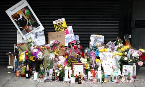 Tributes to Rashan Charles left outside a shop in east London