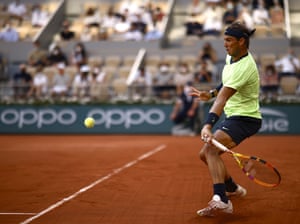 Rafael Nadal fires a forehand to Novak Djokovic.