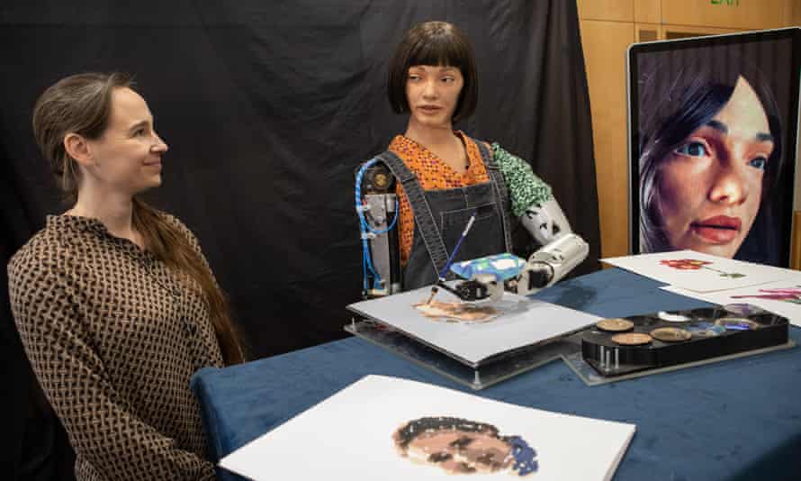 Ai-Da paints Lucy Seal's portrait.