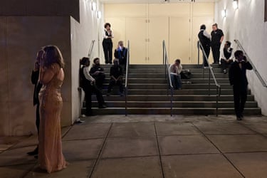 Attendees and hotel workers evacuate after an incident at the Washington Hilton during the White House Correspondents Dinner.