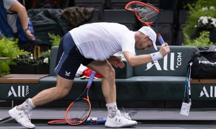 Andy Murray smashes his racket
