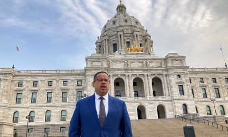 The Minnesota attorney general standing in front of a grand building