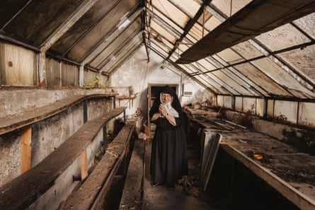 Rita in an empty greenhouse