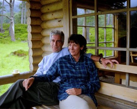 man and woman sit together on bench and smile