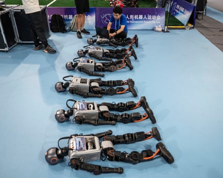 A technician works on humanoid robots