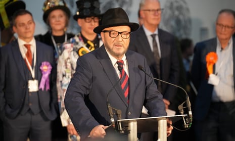 George Galloway speaking at a podium