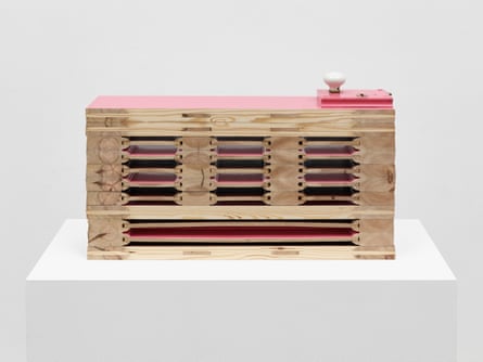 A pink door with layers of horizontal doors beneath it seen in cross-section.
