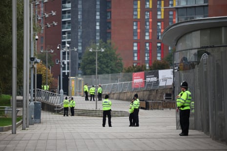 Police officers patrol outside the Arena convention centre ahead of the Labour party conference in Liverpool.