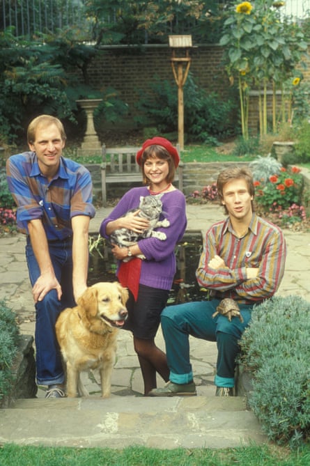 Presenters Simon Groom (with Goldie), Janet Ellis (with Jack) and Peter Duncan (with George) in the Blue Peter garden.