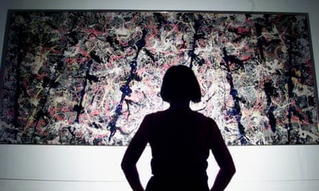 A visitor to the Tate looks at a Jackson Pollock painting