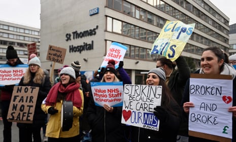 NHS physiotherapists rally outside St. Thomas’s hospital during a strike in London in January