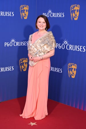 Monica Dolan in a pink dress