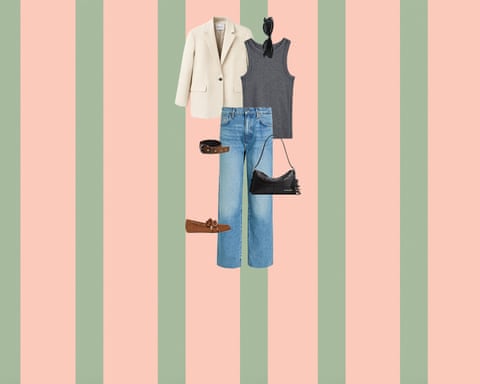 A composite image of a cream linen blazer, black sunglasses, grey racer back vest, blue straight leg jeans, brown belt with silver studs, black leather shoulder bag and brown suede moccasins on a pink and green vertically striped background.