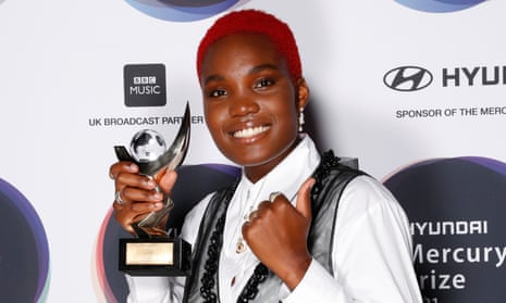 Arlo Parks with her winning trophy at the Mercury prize ceremony.
