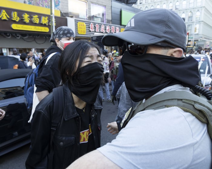Protests erupt as Ice agents conduct raids in New York City's Chinatown – video