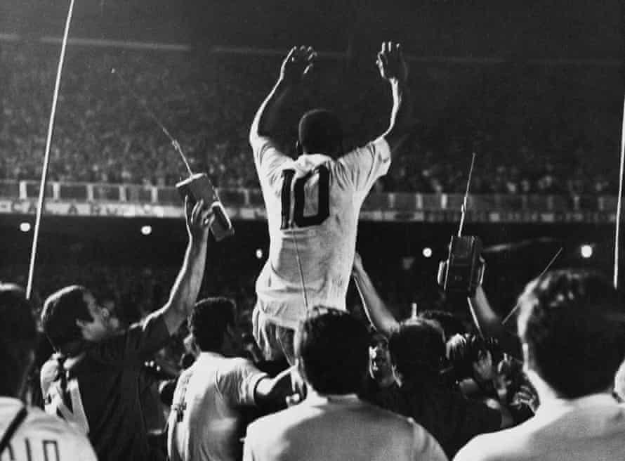 Pele is lifted by his Santos teammates after scoring the 1,000th goal of his career against Vasco da Gama at the Maracanã.