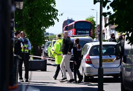 Police on the scene as two people are stabbed in Golders Green.