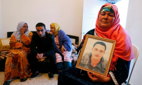 Nour Al Houda with a portrait of her son Anis Amri, the prime suspect in the Berlin truck attack. ‘I want the truth to be revealed about my son,’ she said.