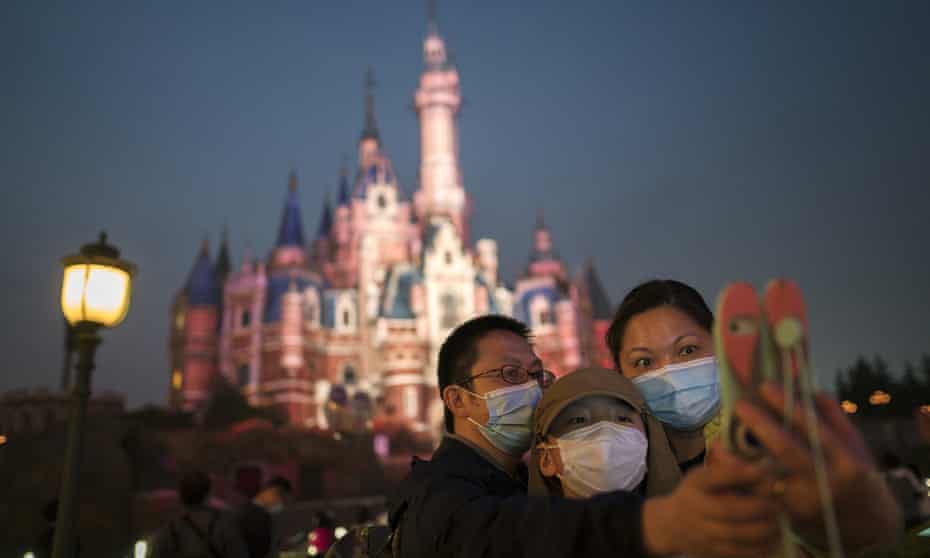 Visitors at Shanghai Disneyland where US attorney general William Barr says government officials are allowed a management role.