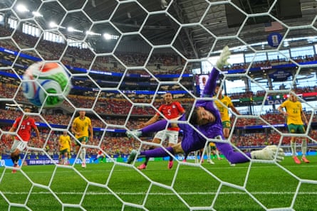 Egypt’s Emam Ashour (8) scores the opening goal past Australia goalkeeper Patrick Beach