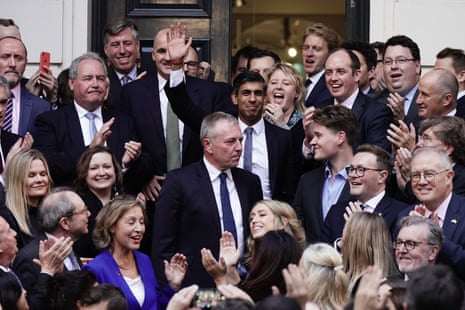 Rishi Sunak posing with fellow Tories outside CCHQ.